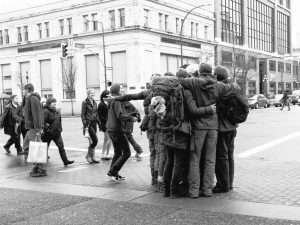 Group of strangers hugging (Photo: Joris Louwes)